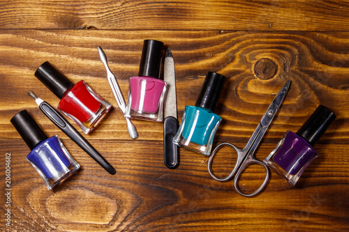 Basic set of manicure tools on wooden background