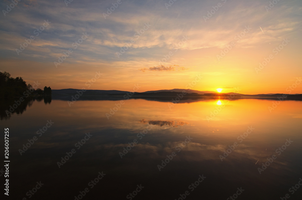 Amazing sunset at the Lipno Dam (Lake). Spring evening. Czech Republic