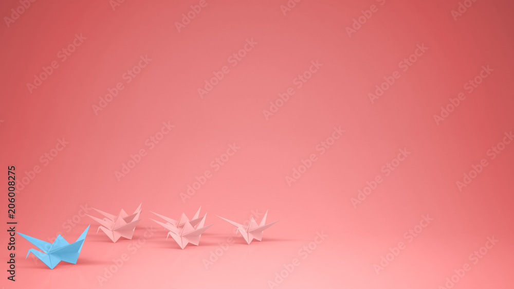 Origami blue paper crane leading group of cranes, leadership motivation concept idea with copy space, pink background
