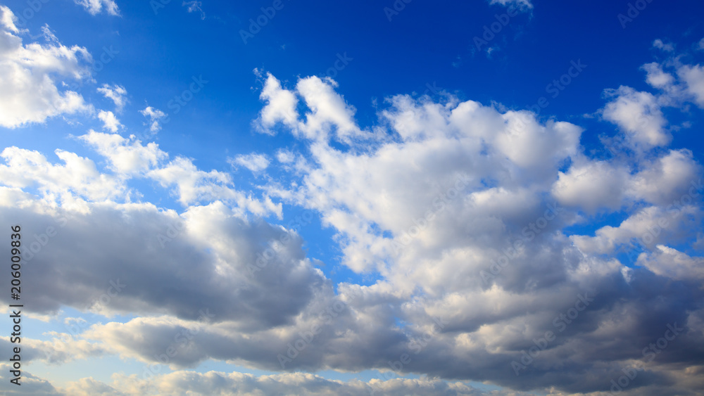 Clouds on a blue sky as a background