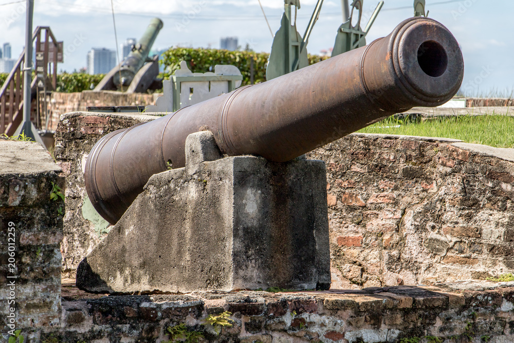 The old large caliber cannon heads to the sky. The historic field-gun at the Cornwallis fortress.