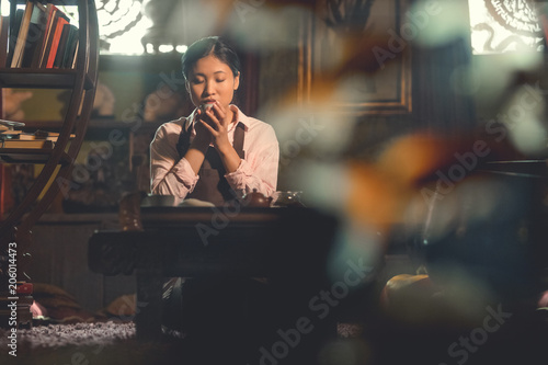 Young asian woman drinking tea