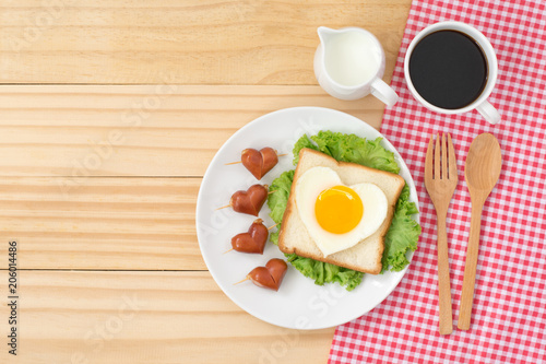 Top view of cute breakfast on wooden background