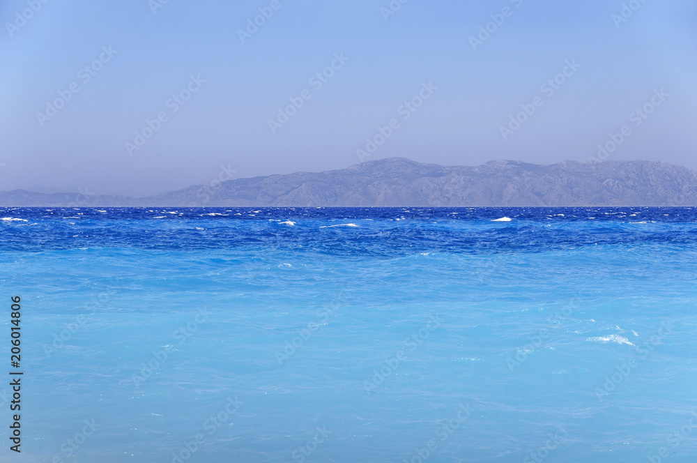 Blue turquoise harmony sea gentle waves at the coast