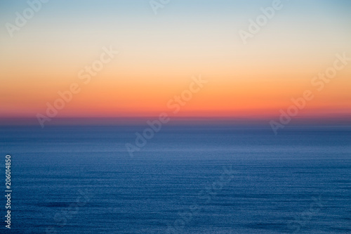 Seascape with colorful evening sky. Natural background. Beautiful sunset over the sea in the Atlantic ocean.