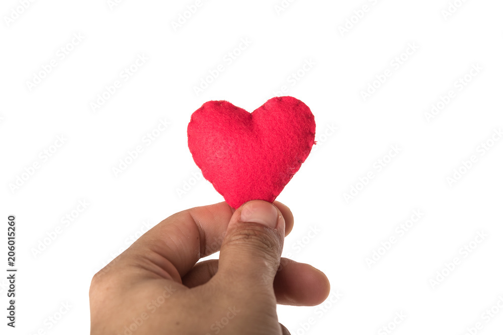 Obraz premium red heart in human hand with dramatic tone
