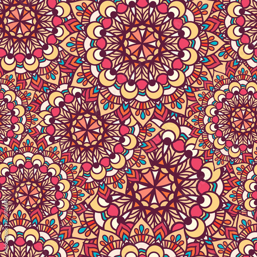 Vector Seamless pattern of circular texture. Mandala is large and small in the background. In boho style for a seamless textile patterns