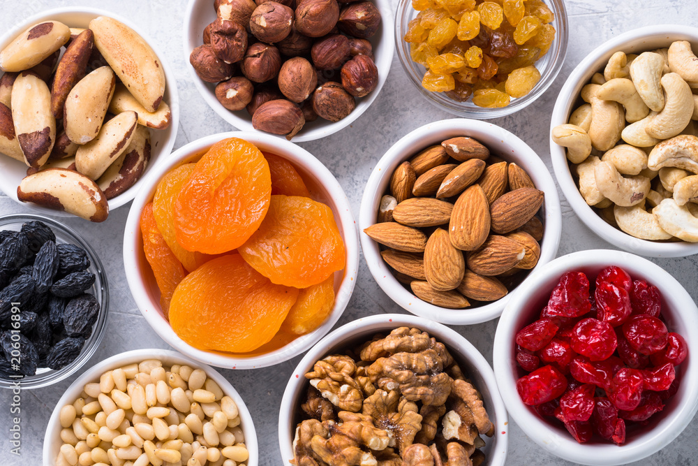 Nuts and dried fruits assortment on stone table top view. Nuts and dried fruits assortment on stone table top view.