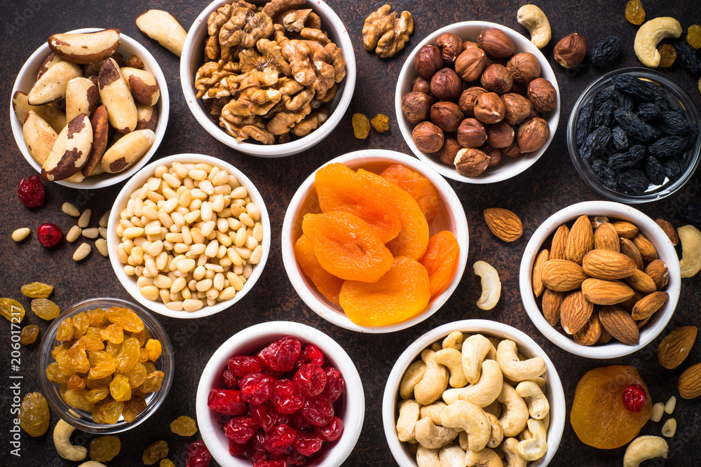 Nuts and dried fruits assortment on stone table top view. Nuts and dried fruits assortment on stone table top view.