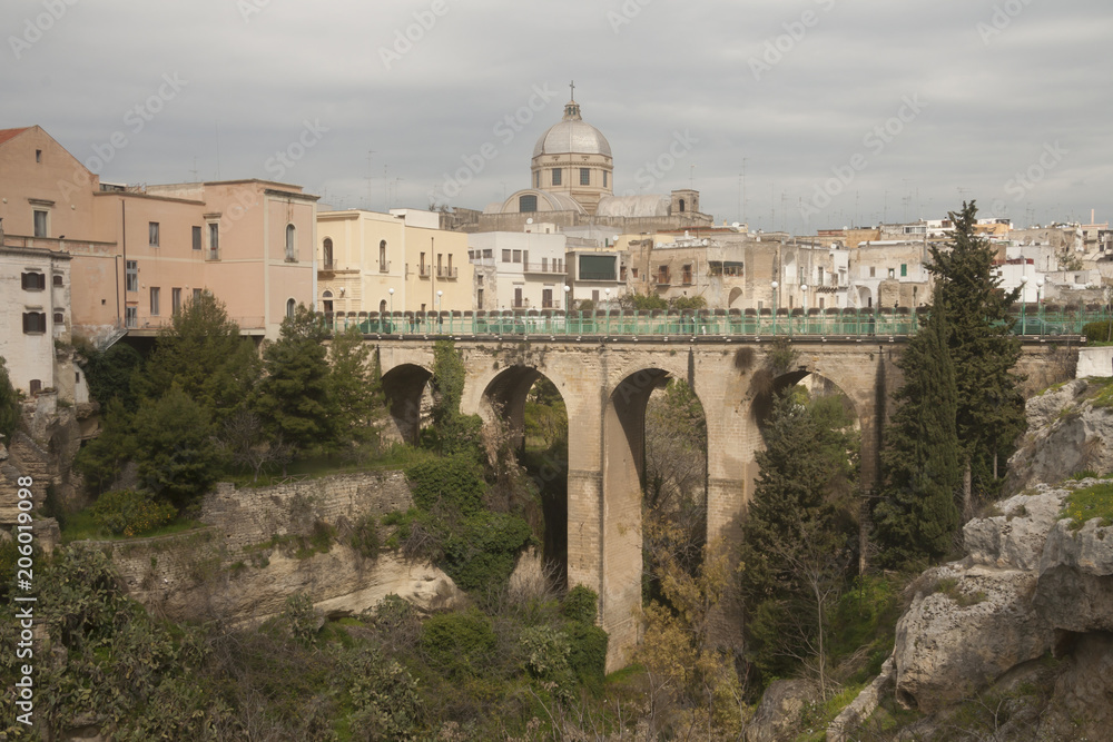 Bridge over he canyon in small beautiful town in South Italy Massafra, region Puglia
