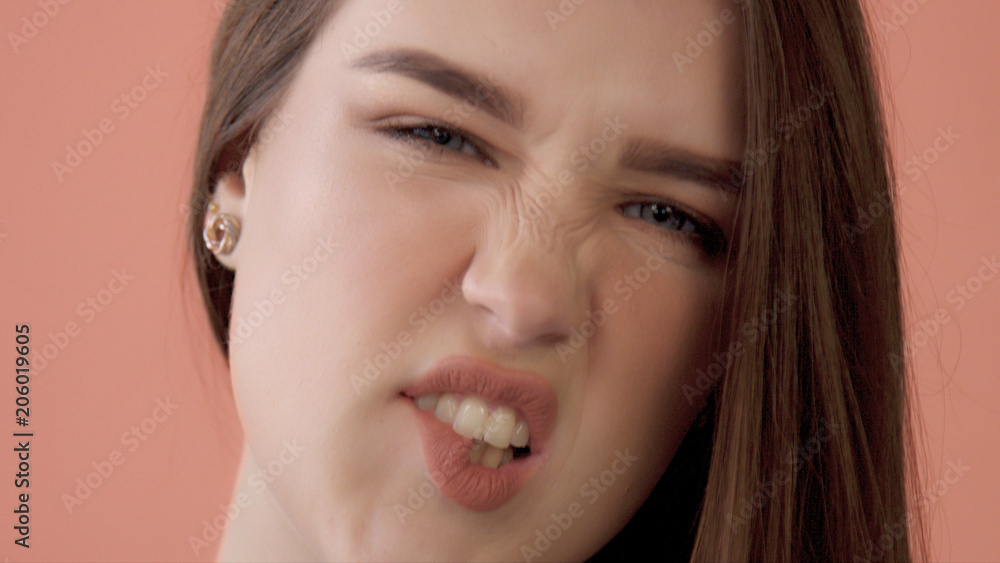 closeup of young model having fun and making faces, quaver, play the ape to a camera Closeup portrait closeup of young model having fun and making faces, quaver, play the ape to a camera Closeup portrait