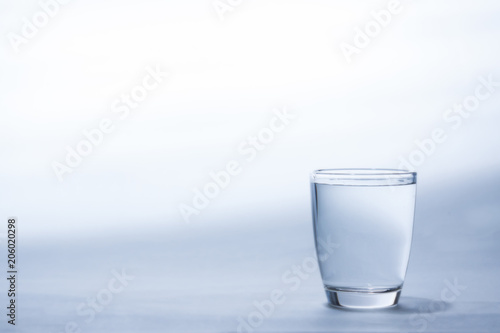 Water in glass on white background