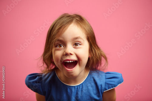 surprised little girl with eyes wide open and mouth