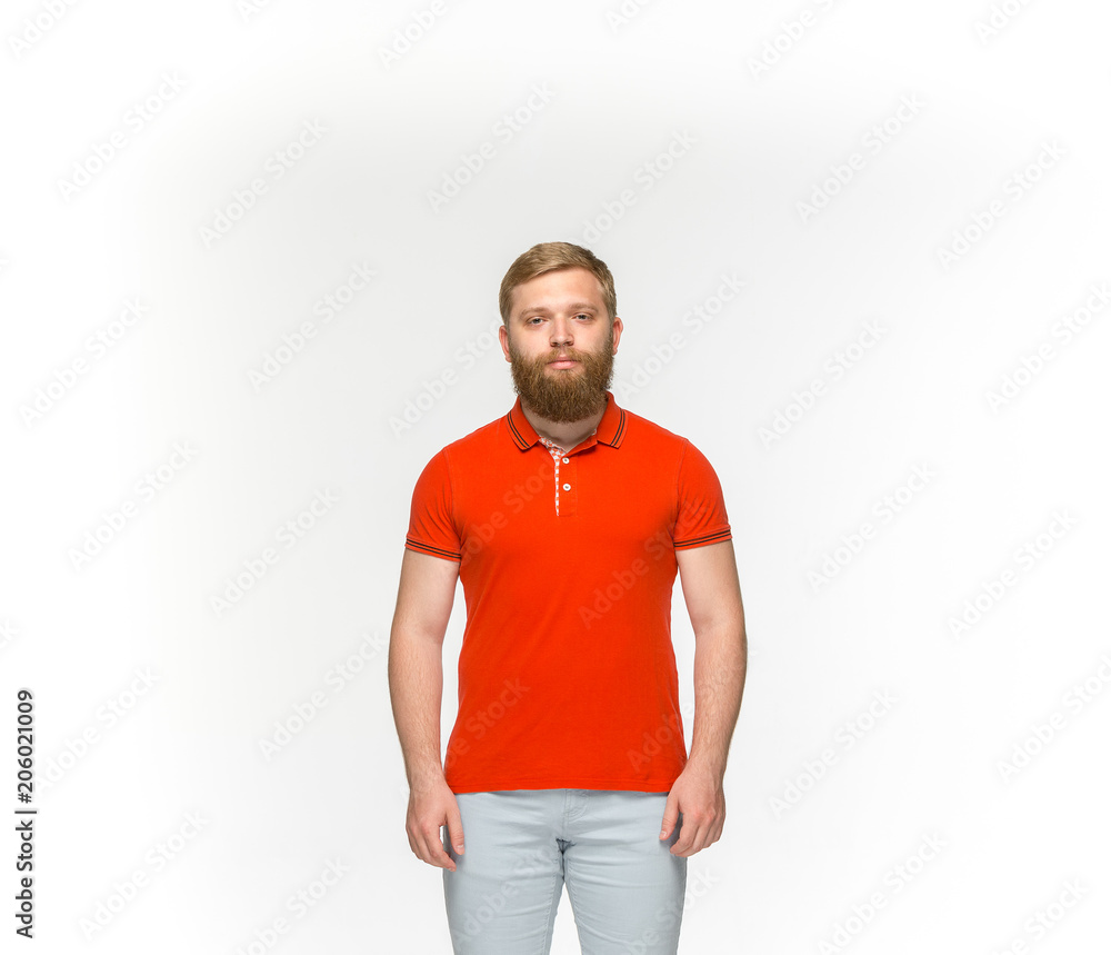 Closeup of young man's body in empty red t-shirt isolated on white background. Mock up for disign concept Closeup of young man's body in empty red t-shirt isolated on white background. Mock up for disign concept