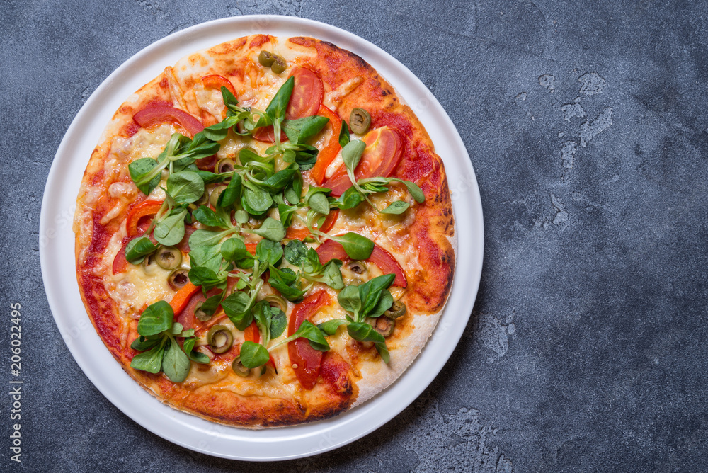 Vegetarian pizza on grey background, copy space Vegetarian pizza on grey background, copy space