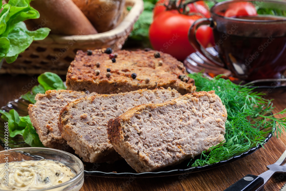 Homemade delicious meat pate with chicken liver on a plate Homemade delicious meat pate with chicken liver on a plate