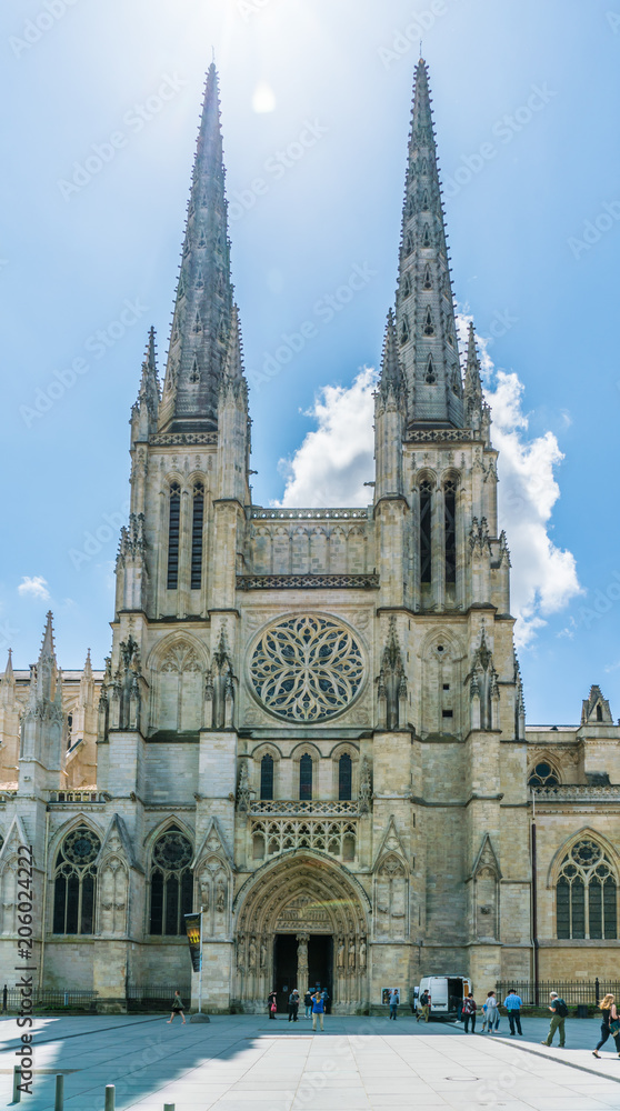 Bordeaux, France, 9 may 2018 - tourist passing the Famous Cathédrale Saint-André de Bordeaux