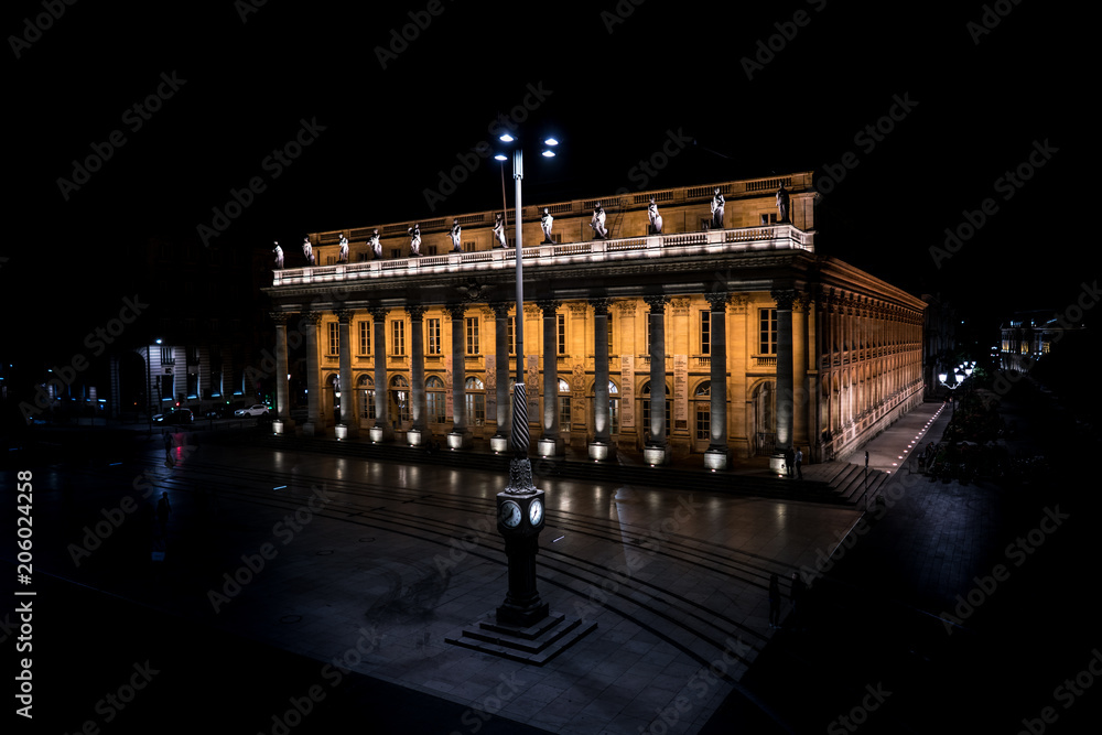 Fototapeta premium Bordeaux, France, 10 may 2018 -The grand Opera House 'Grand Théâtre de Bordeaux' at night on the Main square 'Place de La Comedie' in the center of town