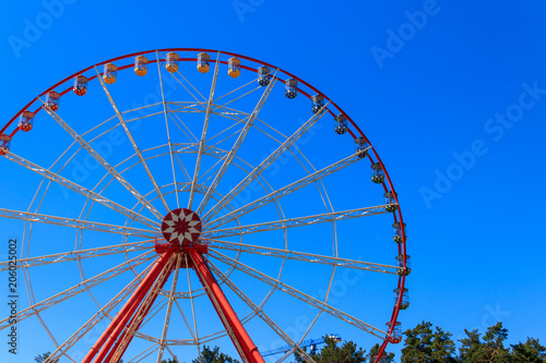 Ferris wheel on background of blue sky in Gorky Park. Kharkov  Ukraine
