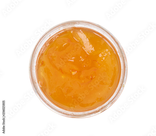 Orange homemade jam isolated on white background. Top view.