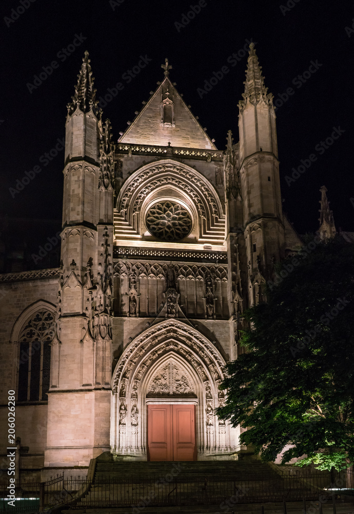 Bordeaux, France, 10 may 2018 - Side entrance of the Basilica of St. Michael at night