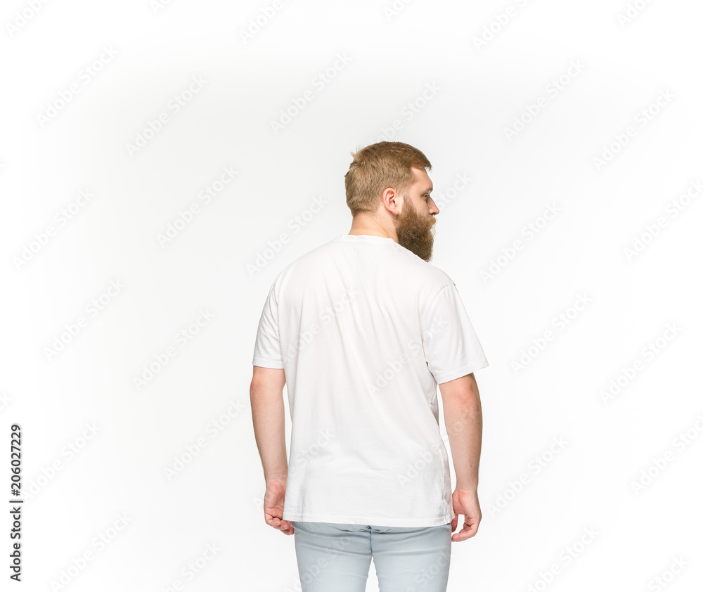 Closeup of young man's body in empty white t-shirt isolated on white background. Mock up for disign concept Closeup of young man's body in empty white t-shirt isolated on white background. Mock up for disign concept