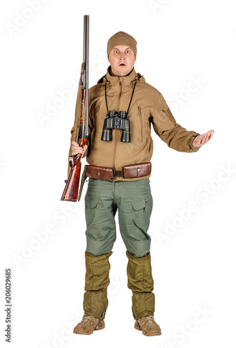 Full length portrait of a male hunter with double barreled shotgun Isolated on white background. hunting and people concept.