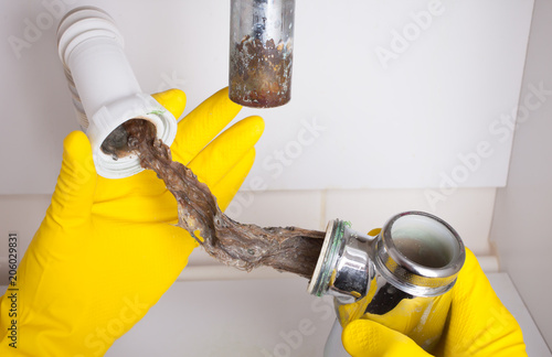 Фотография Washbasin's siphon cleaning in a bathroom