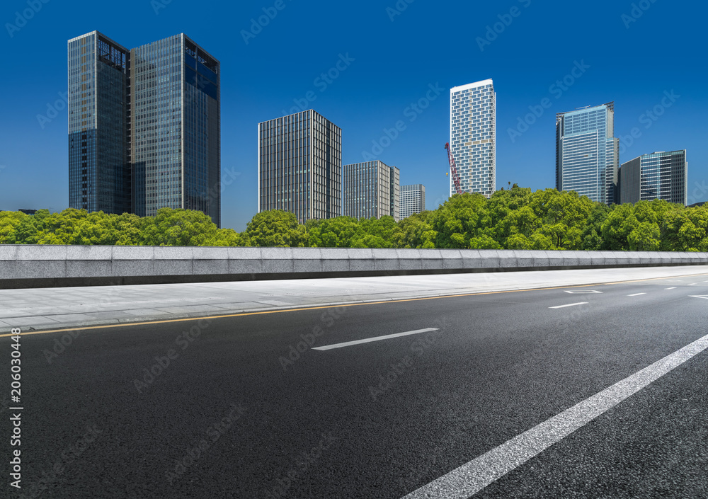 Empty urban road and modern skyline. Empty urban road and modern skyline.
