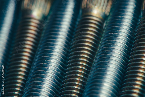 Wallpaper Mural Background from automotive bolts in blue and yellow tones close up. Torontodigital.ca