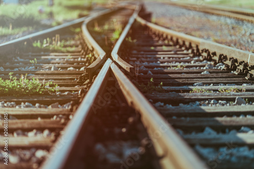 Railway crossroads. Choosing the right pathy, making decision, having doubts, choice way concept. Shallow depth of field. photo