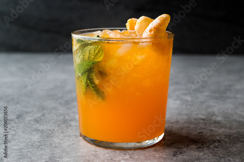 Mandarin Mojito Cocktail with Mint Leaves and Crushed Ice / Tangerine or Clementine