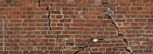 Fényképezés The cracks in an old brick wall. Texture