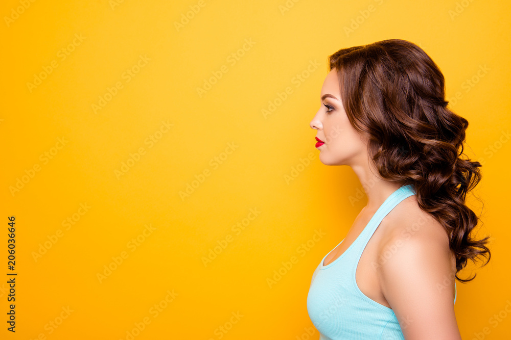 Half face profile portrait with copyspace empty place for product of calm dreamy girl with modern hairdo make up isolated on yellow background Half face profile portrait with copyspace empty place for product of calm dreamy girl with modern hairdo make up isolated on yellow background
