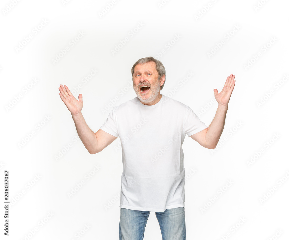 Closeup of senior man's body in empty white t-shirt isolated on white background. Mock up for disign concept Closeup of senior man's body in empty white t-shirt isolated on white background. Mock up for disign concept