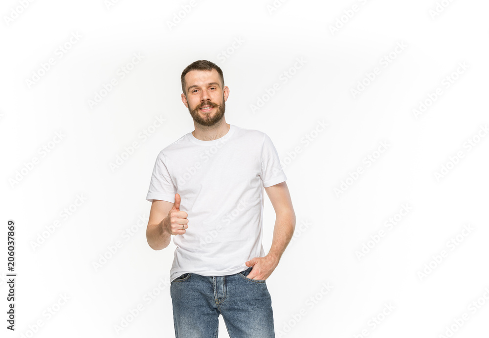 Closeup of young man's body in empty white t-shirt isolated on white background. Mock up for disign concept Closeup of young man's body in empty white t-shirt isolated on white background. Mock up for disign concept