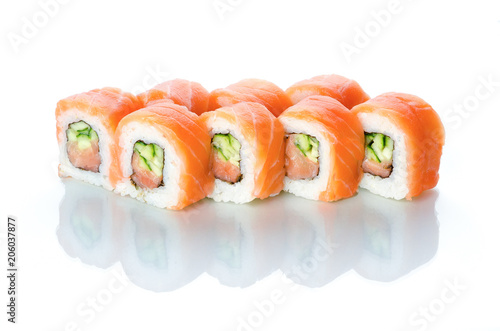 sushi rolls salmon cucumber and spice sauce on white background with reflection