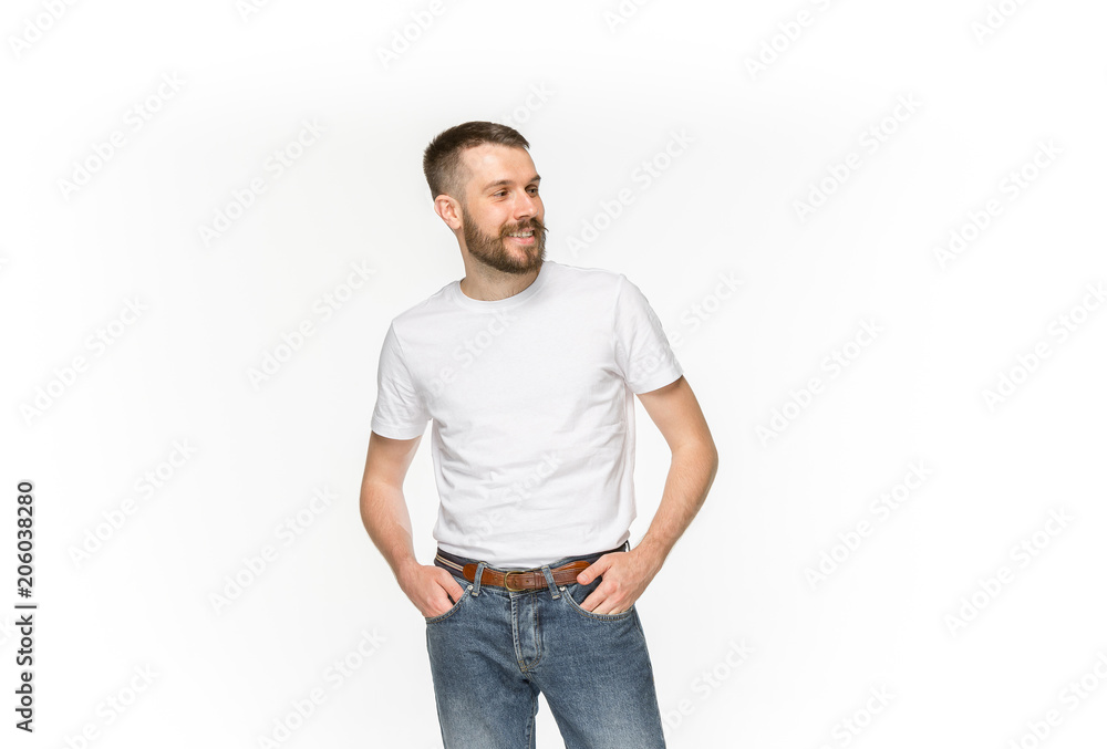 Fototapeta premium Closeup of young man's body in empty white t-shirt isolated on white background. Mock up for disign concept