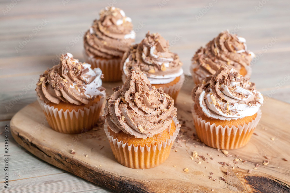 Vanilla cupcakes with chocolate cream end topping. homemade baking