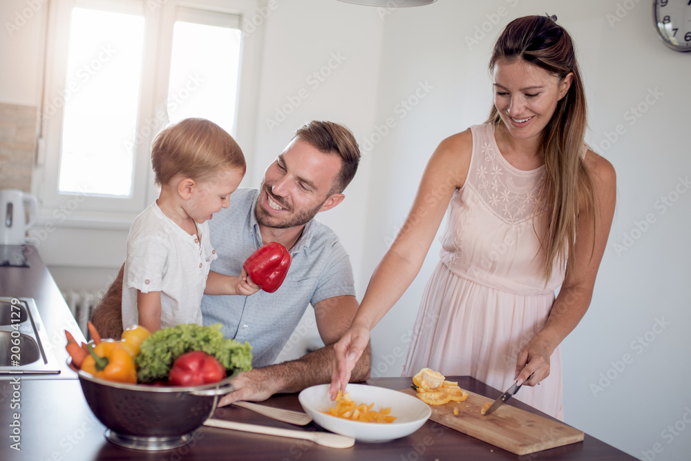Family  preparing meal with son