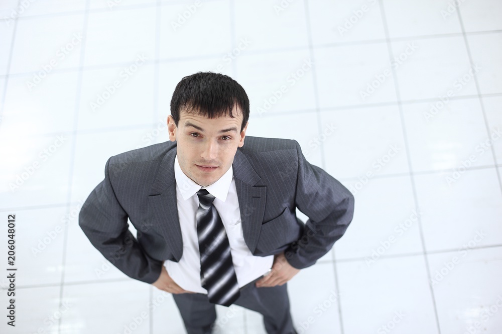 view from the top: portrait of smiling businessman view from the top: portrait of smiling businessman