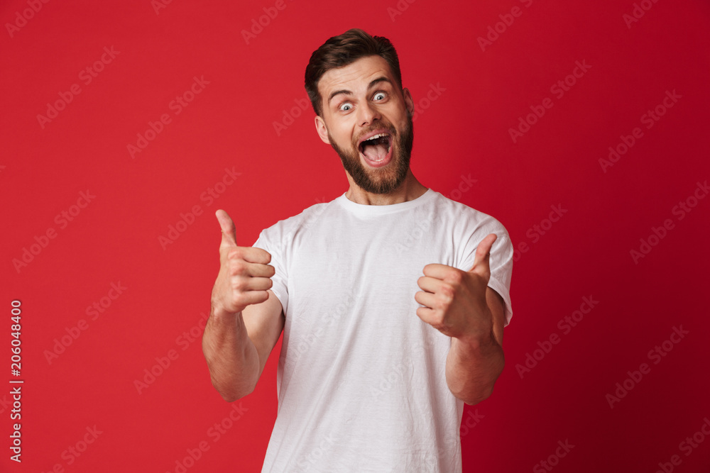 Happy young handsome man showing thumbs up. Happy young handsome man showing thumbs up.