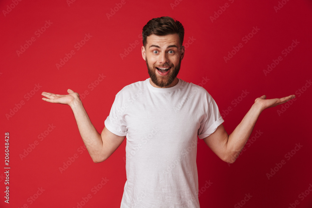 Emotional young handsome man showing copyspace. Emotional young handsome man showing copyspace.