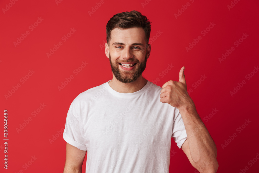 Happy young handsome man showing thumbs up. Happy young handsome man showing thumbs up.