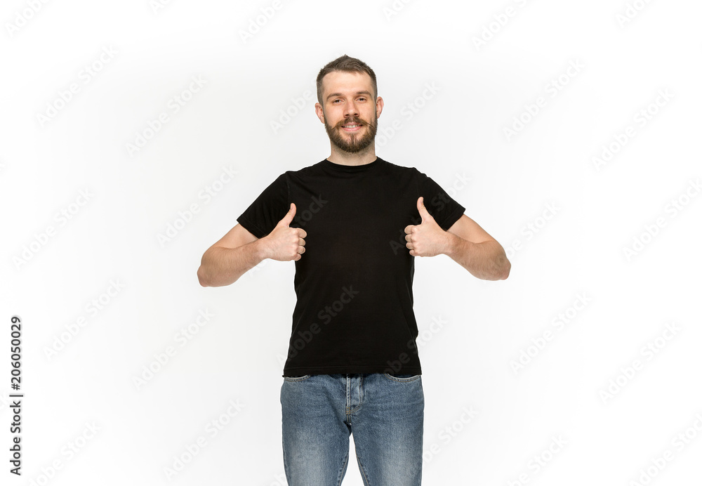 Closeup of young man's body in empty black t-shirt isolated on white background. Mock up for disign concept Closeup of young man's body in empty black t-shirt isolated on white background. Mock up for disign concept