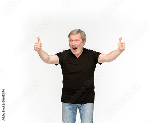 Closeup of senior man's body in empty black t-shirt isolated on white background. Mock up for disign concept