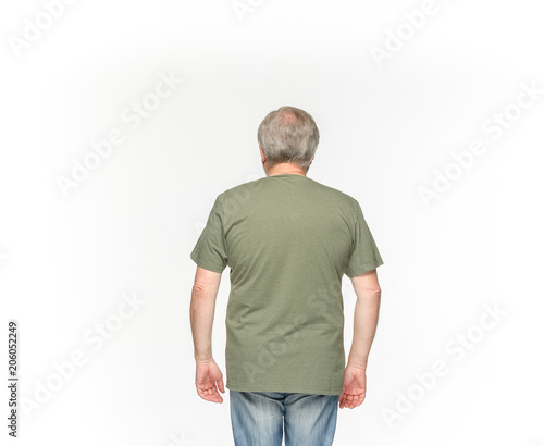 Closeup of senior man's body in empty green t-shirt isolated on white background. Mock up for disign concept