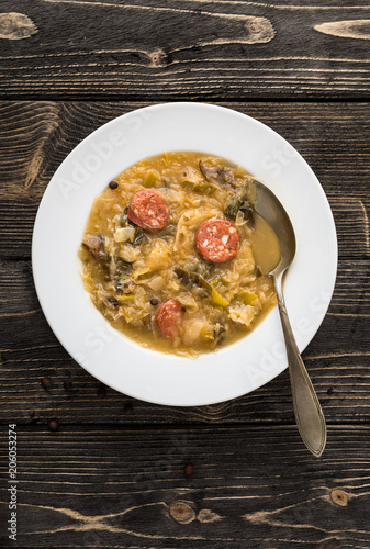 Slovak christmas cabbage soup with mushrooms on natural background.