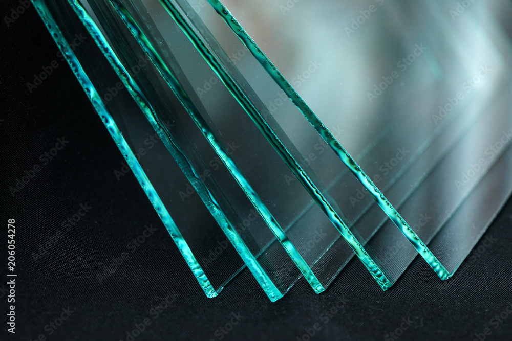 Sheets of Factory manufacturing tempered clear float glass panels cut to size - obrazy, fototapety, plakaty 