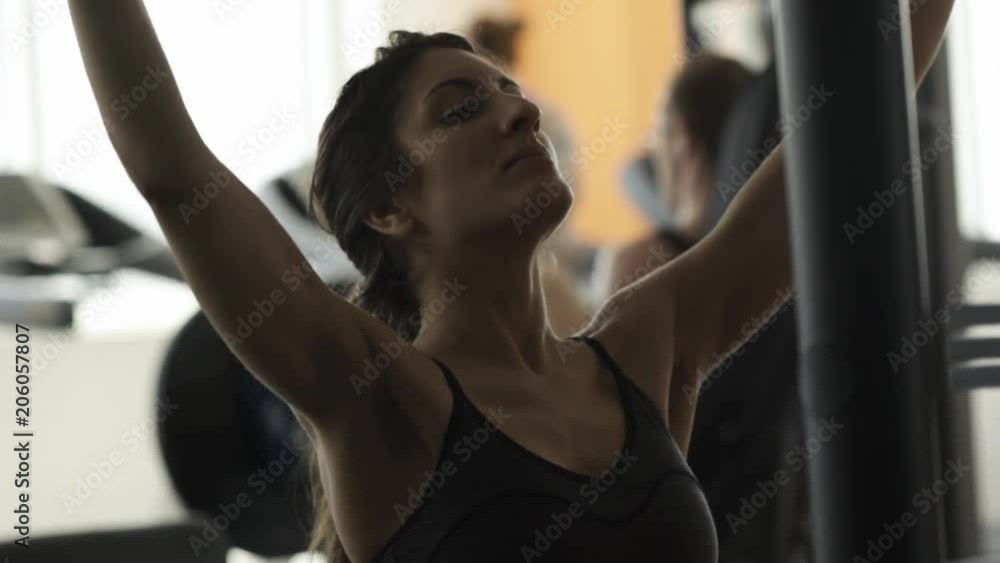 Young woman doing weight training Young woman doing weight training